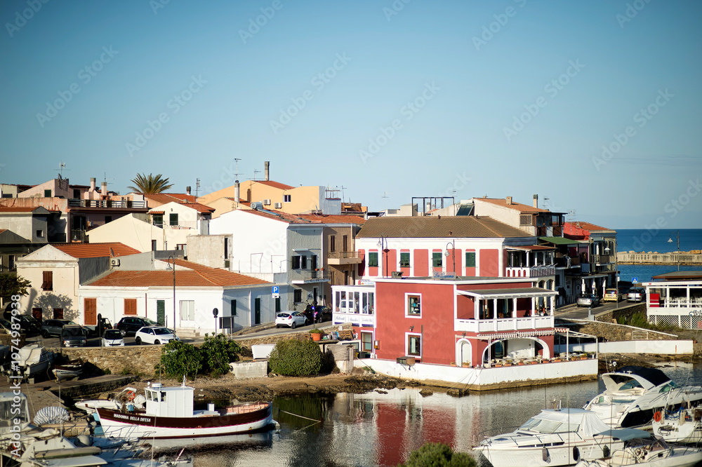 Obraz premium old dock of Stintino in the Porto Vecchio now transformed into a restaurant, Sardinia, Italy