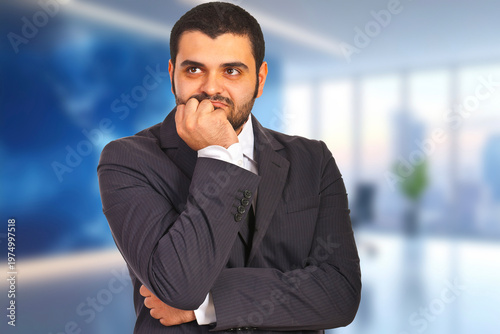 Dapper man in suit ponders thoughtfully