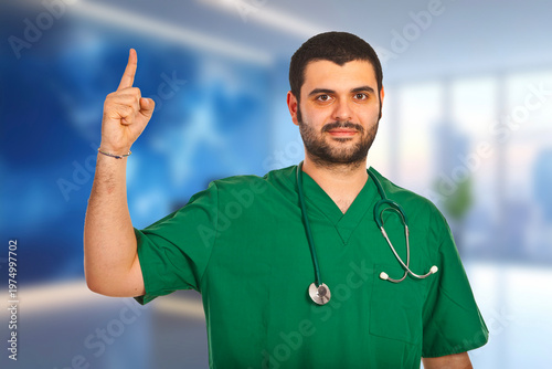Green scrubs and stethoscope suggest medical expertise
