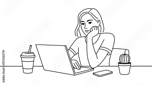 A focused young woman with short hair works diligently on her laptop at a desk.