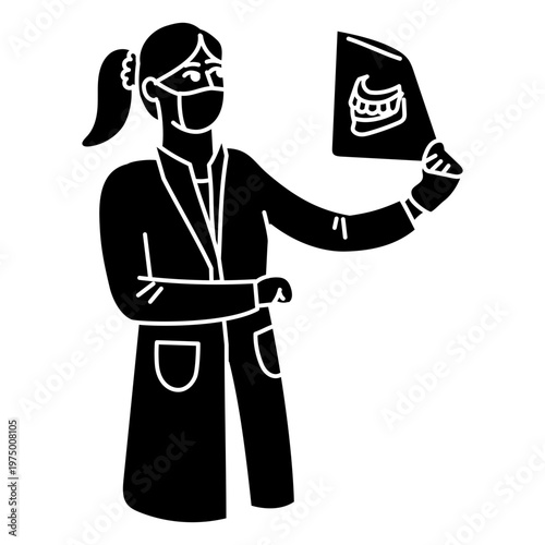 Dentist reviewing dental x-ray