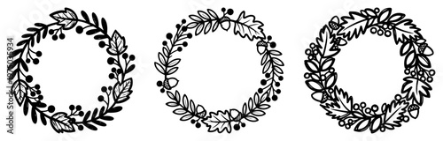 Floral wreaths with leaves berries and acorns for decorative border in black and white botanical style