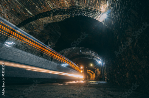Street Underground Stone Tunnel with Arched Vaults, trace of lights historic buried city wonder in Guanajuato, Mexico.