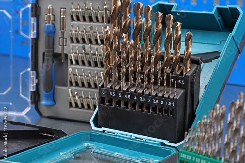 A set of drills for drilling metal in a plastic case.