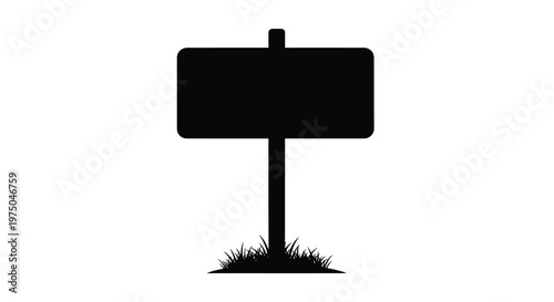 A simple black signpost with grass below a stark silhouette