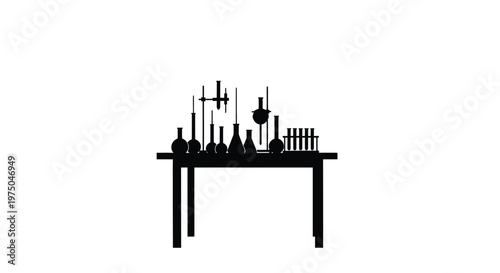 A black silhouette of laboratory equipment arranged on a table
