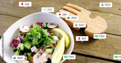 Popping social bubbles flooding salad bowl on wood table overlapping fork trivet showing engagement