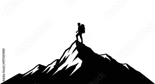 Person standing on mountain peak summit.