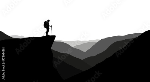 Person standing on mountain cliff edge.