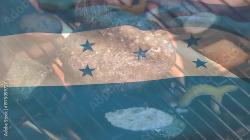 Animation of national flag waving over meat and vegetables cooking on barbecue grill