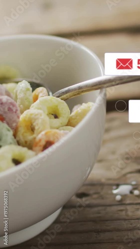 Vertical video: Bowl settling, badges appearing, cursor clicking, milk pouring, showing social buzz