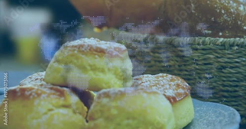 Camera tilting, pulling back, four rolls on plate coming into focus showcasing bakery dotted map