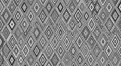 Seamless geometric diamond pattern in monochromatic grayscale for modern abstract background and decorative texture.