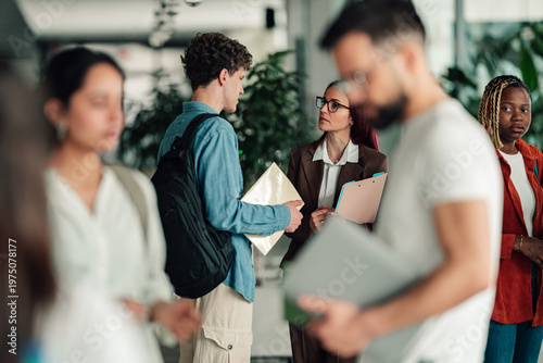 Students and a professor collaborating in a modern university setting, focusing on learning and academic guidance