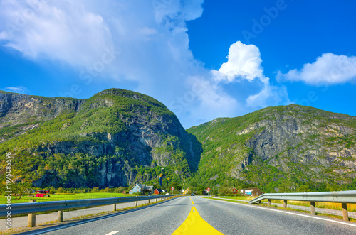 Panoramic view with empty wide road against background of  mountains landscape. Norway