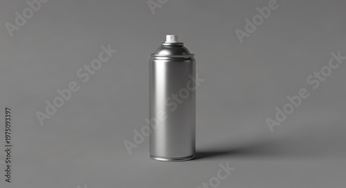 Gray metal aerosol spray can with white nozzle on gray surface