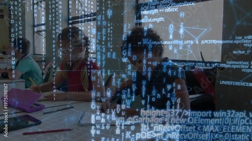 Wheelchair pupil writing with peers on notes and classwork while projecting code overlay over table