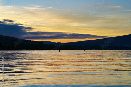 View over Loch Lomond from Balloch during sunset. It is part of the Loch Lomond and The Trossachs National Park 