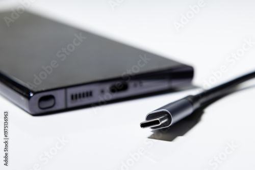 Valokuva USB Type C cable with smartphone charging port on white background
