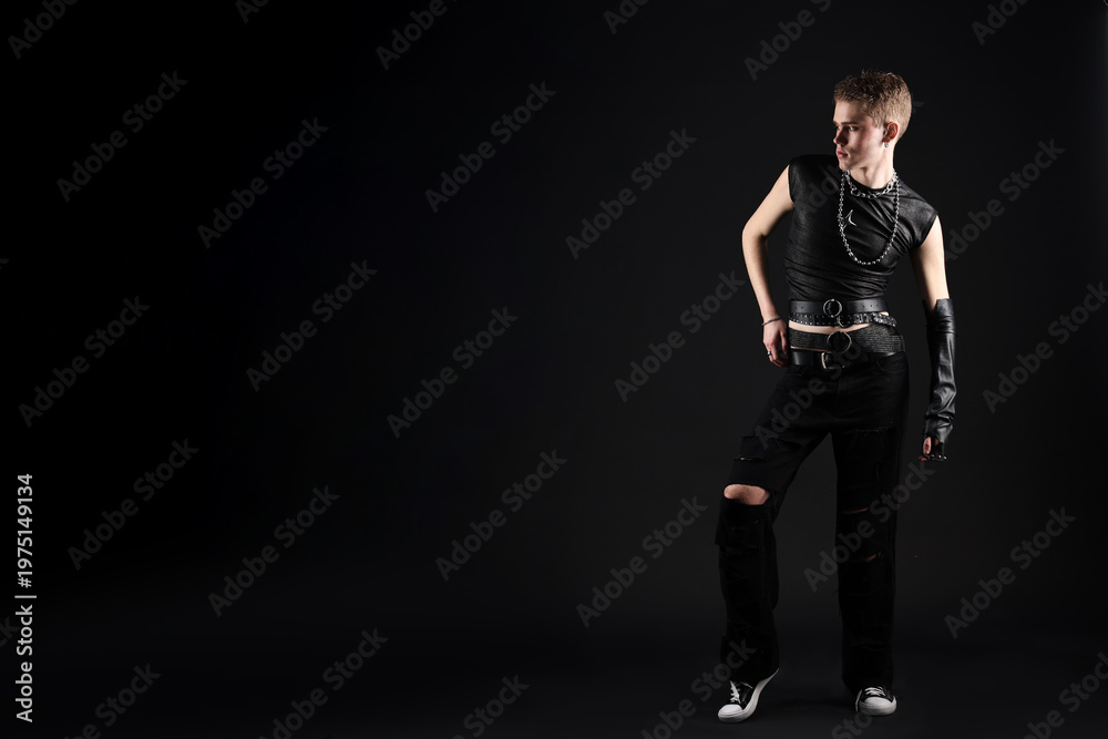 Fototapeta premium Young man in stylish clothes and accessories on black background, space for text