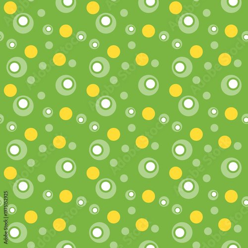 Playful green pattern with yellow and white polka dots and soft rings. Seamless vibrant design perfect for kids products, textiles and cheerful backgrounds.