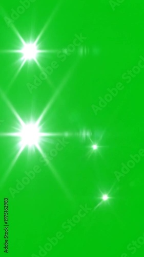 A vibrant green background featuring multiple bright white starburst light effects
