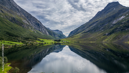 Bild auf Leinwand Symmetrical Reflection of Lake Eidsvatnet between Mountains, Norway