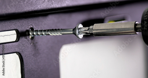 Obraz na plátně Screw being installed in a wall using a drill with a screwdriver bit in a home i