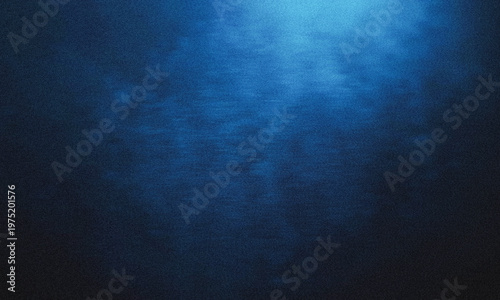 Blue underwater light rays shining through deep ocean water with soft gradient texture and dark atmosphere creating calm aquatic background