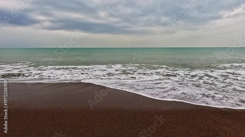 Beautiful sea waves on sandy beach