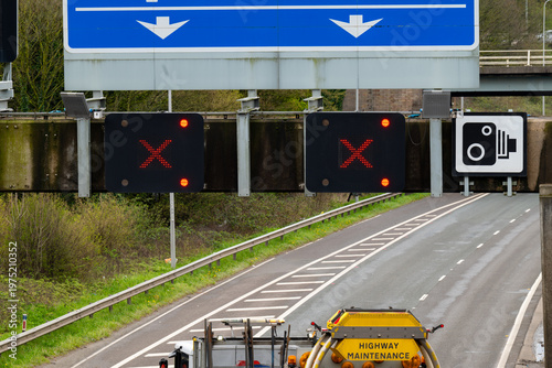 Road closed - RED X on a motorway gantry above two lanes indicating that traffic is prohibited from entering lane. 