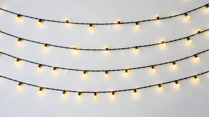 Illuminated strings of warm glowing fairy lights creating a festive and decorative ambiance on a plain white background