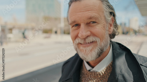 Smiling Older Man With Beard Outdoors In City