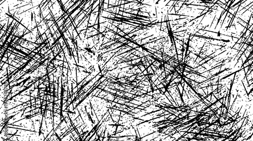 Abstract monochrome texture with chaotic scratches and intersecting lines.