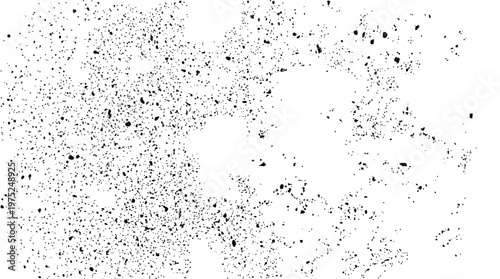 Abstract speckled dot pattern on white background creating a monochrome texture.