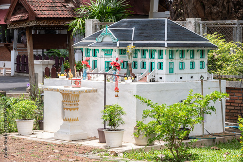 A mock-up gingerbread style spirit house in Khum Chao Luang Muang Phrae in Phrae  province, Thailand.
