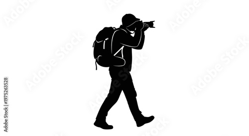 Silhouette of a photographer with a backpack, capturing a moment