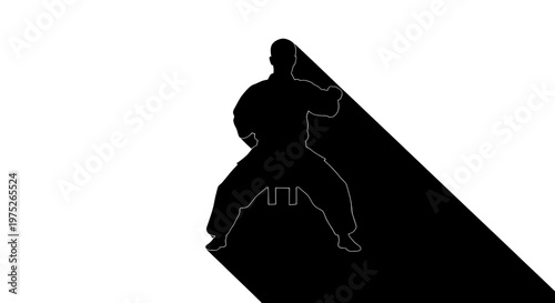 Karate Silhouette: Martial Arts Fighter Performing Kata with Long Shadow