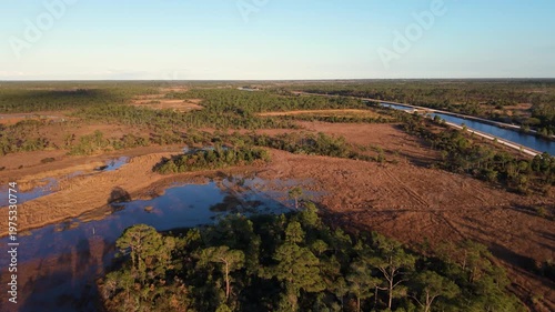 Push in drone shot of the John C. and Mariana Jones Hungryland Wildlife and Environmental Area in Palm Beach and Martin County showing the vast extent of the land including canals, ponds and prairies.