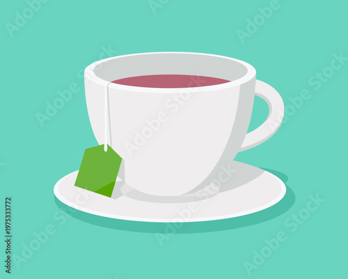 A white teacup filled with reddish brown tea and a green teabag