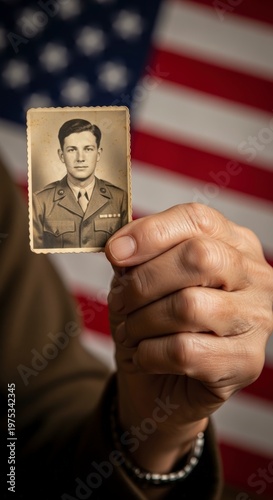 Vintage photo of soldier with American flag.