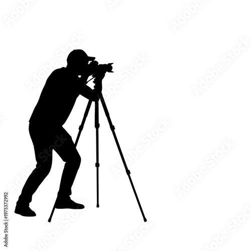 Photographer capturing a scenic view at sunset