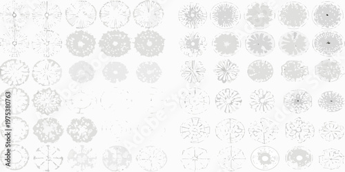 Numerous circular snowflake like patterns arranged in a grid formation