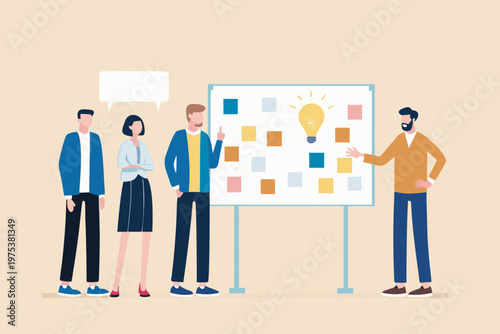 Team brainstorming session with a whiteboard and a bright idea