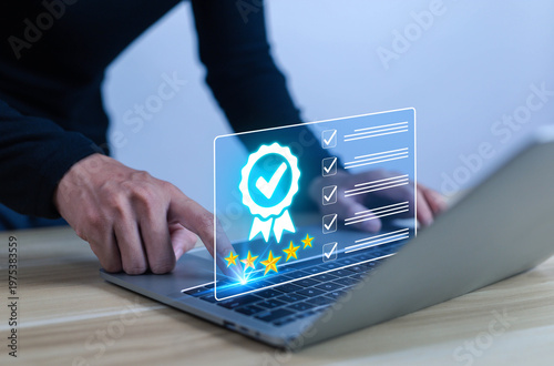 Businessman using laptop with digital quality certification checklist and five star rating, representing customer satisfaction, service excellence, online review, trust, compliance, and performance 