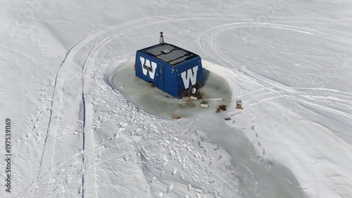 Ice Fishing Hut Frozen In Ice On Lake Manitoba