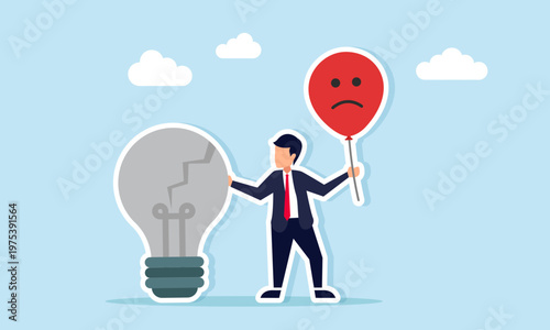 Businessman holding sad emoticon balloon standing near broken light bulb illustration of negative response to failure in applying business idea