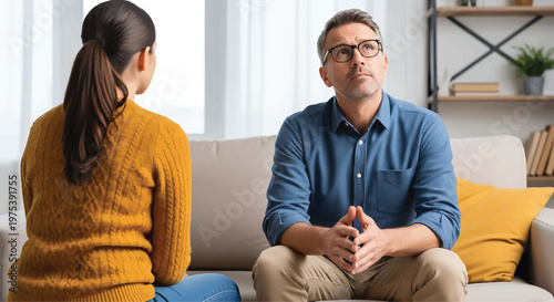 Psychologist Consulting Patient on Sofa in Living Room