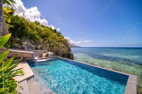 Tropical infinity pool with waterslide overlooking Caribbean Sea