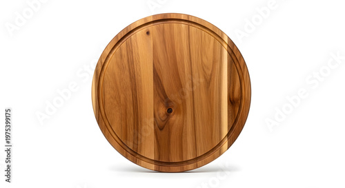 A top down view of a circular wooden cutting board with natural grain and a juice groove around the edge